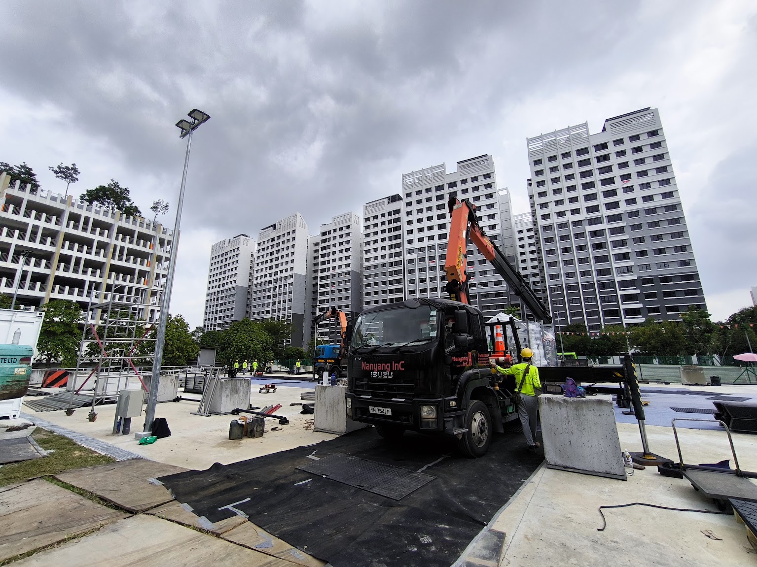 Nanyang Inc crane trucks and installation team at the PW10 Punggol West Community Square construction site