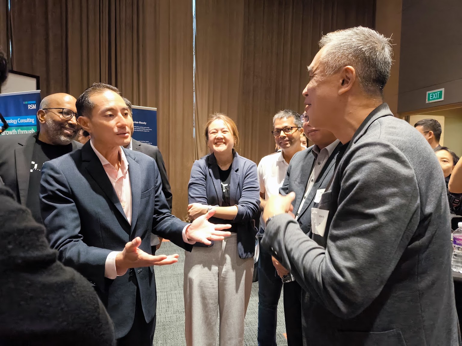 Don Ho speaking with Tan Kiat How at ATxEnterprise 2026.