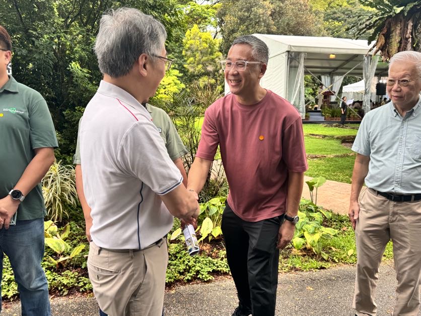 Don Ho shaking hands with Gan Kim Yong at the opening of HortFest 2025 at HortPark.